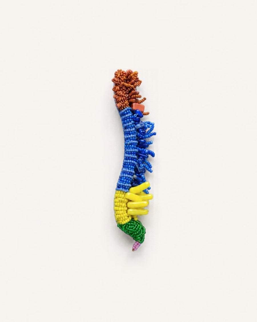 The Betsy spine anatomy dress pin in metallic wire with glass beads by House of Rednam
