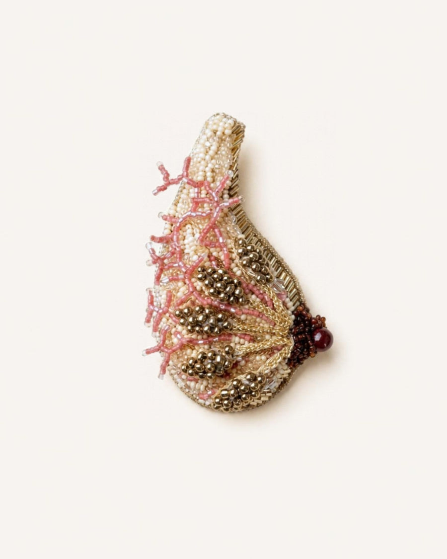 The Cheryl breast anatomy dress pin in metallic wire with glass beads by House of Rednam