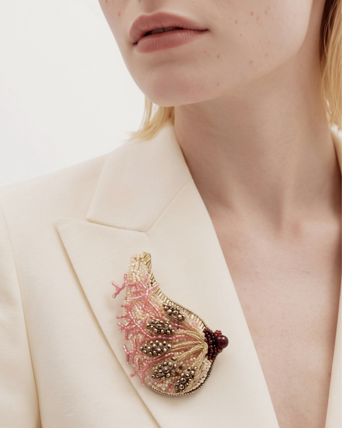 The Cheryl breast anatomy dress pin in metallic wire with glass beads by House of Rednam
