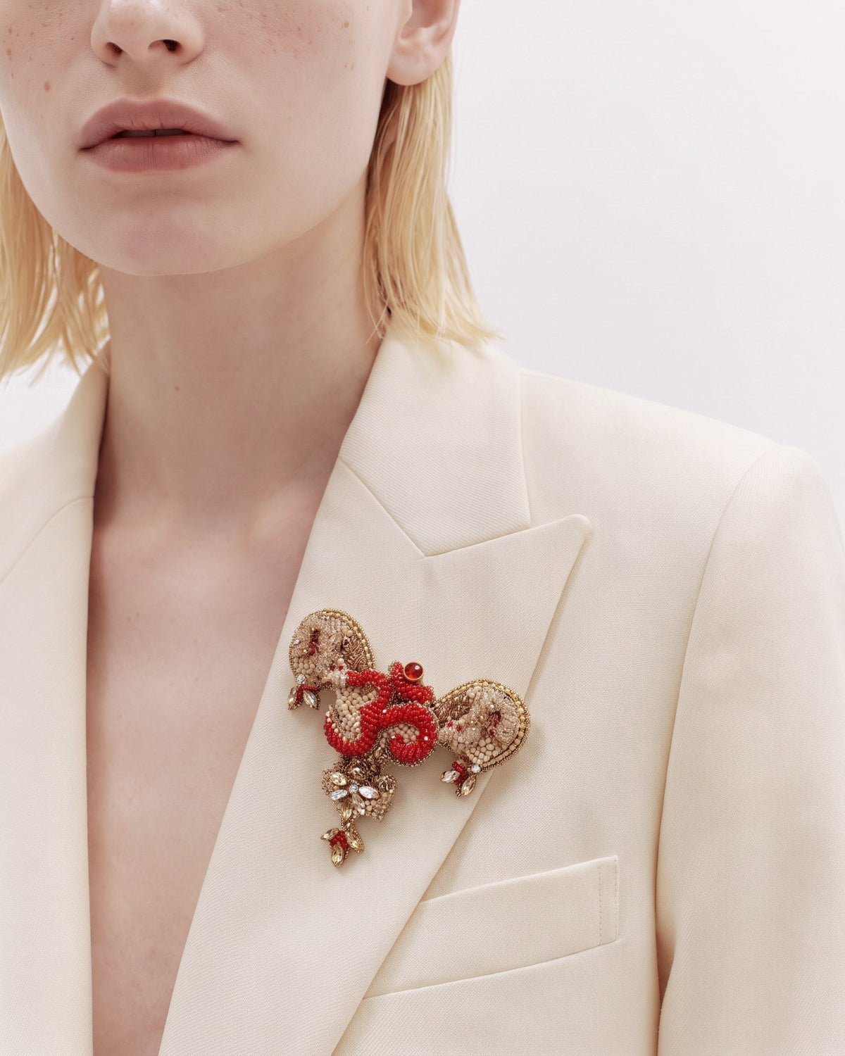The Gladys uterus anatomy dress pin with an Om at its center by House of Rednam