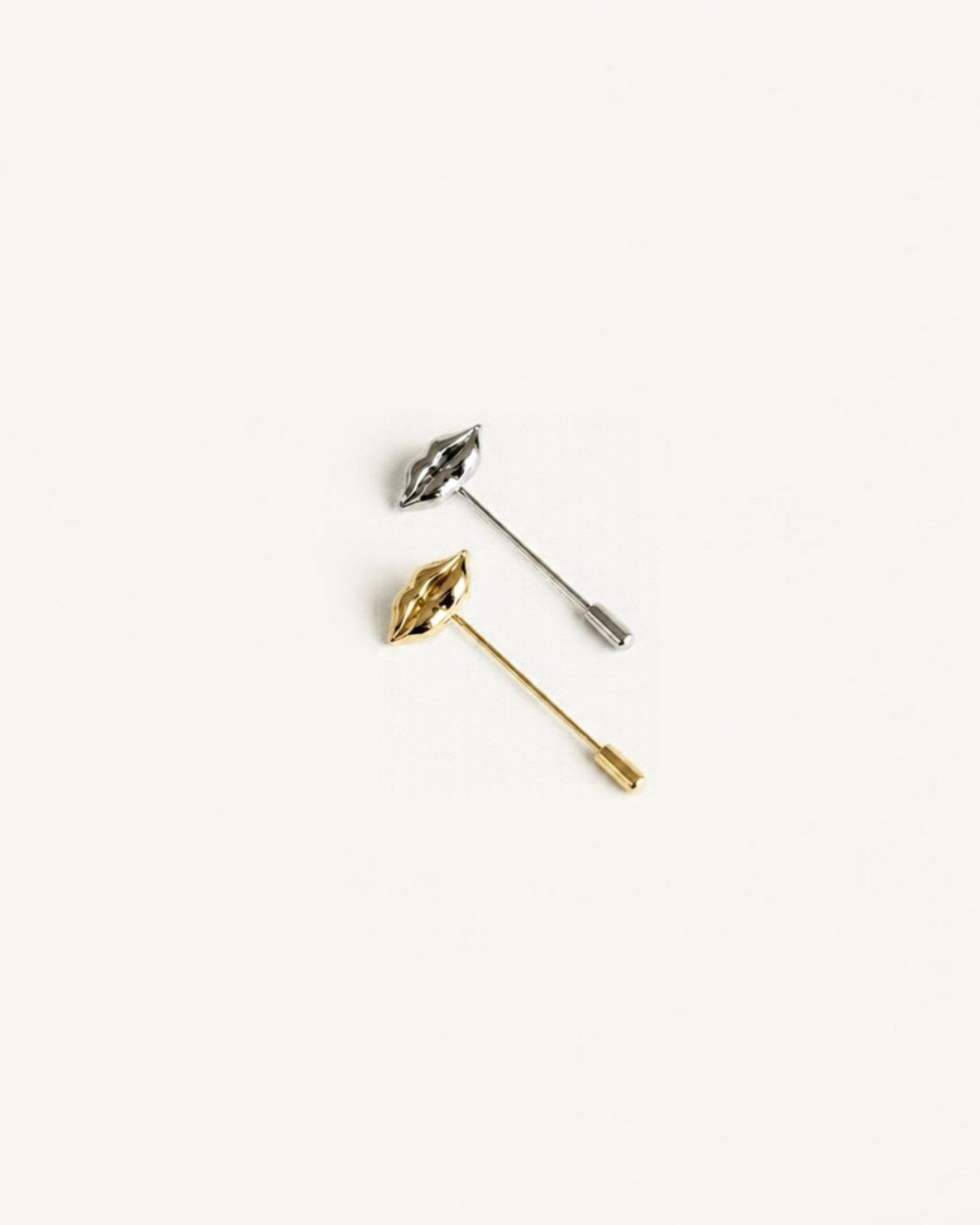 Gold-plated sculpted lips jacket pin with diamond accent by House of Rednam