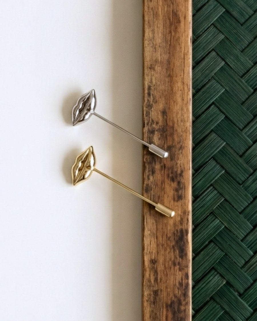 Gold-plated sculpted lips jacket pin with diamond accent by House of Rednam