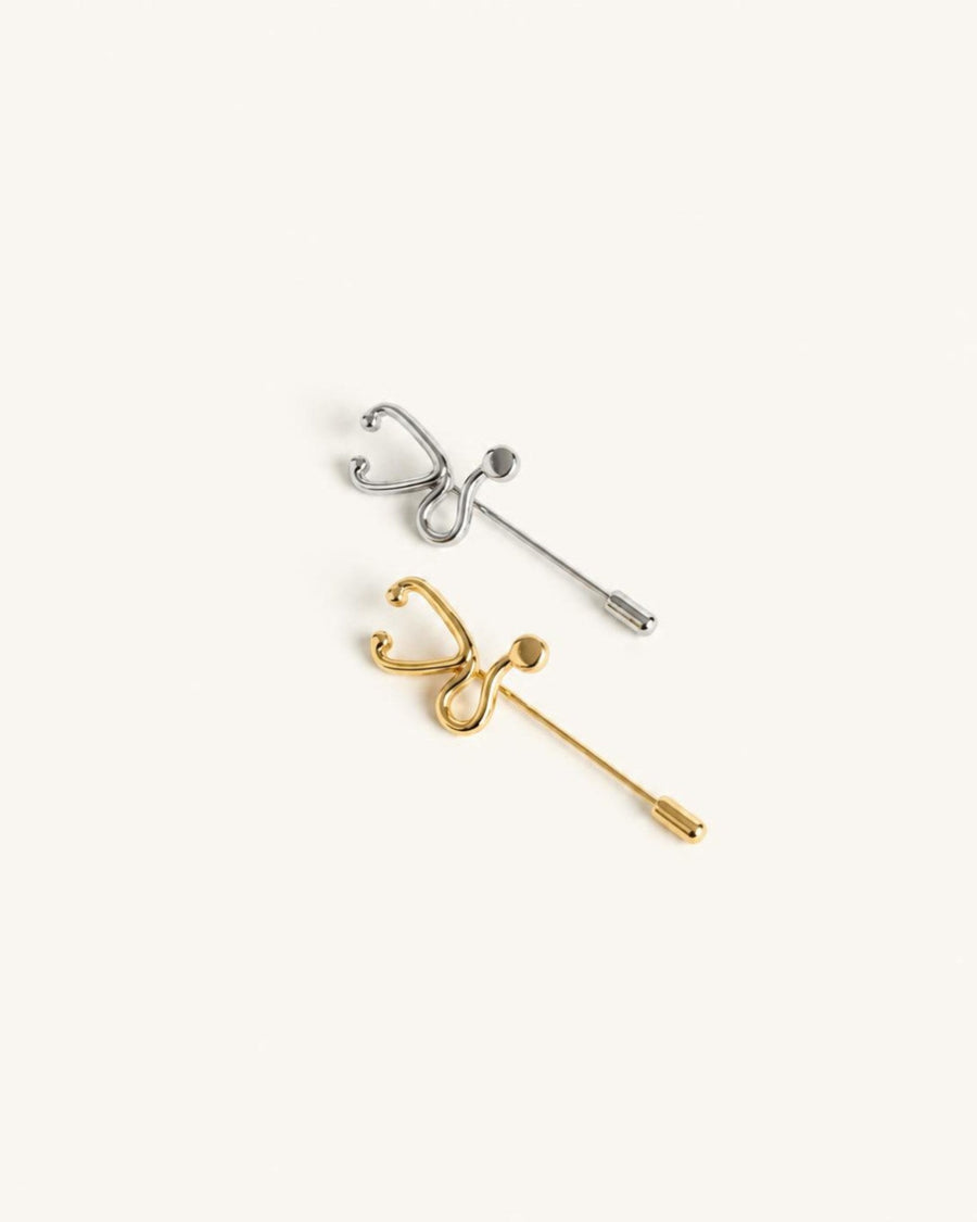 The Surya gold-plated stethoscope pin with diamond detail by House of Rednam