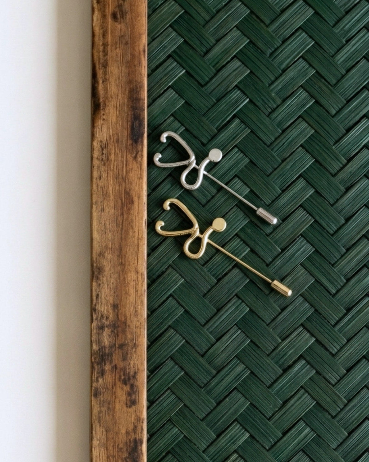 The Surya gold-plated stethoscope pin with diamond detail by House of Rednam