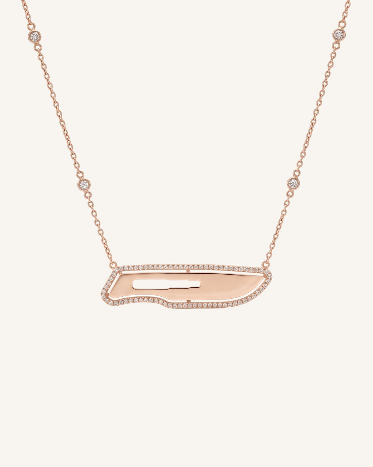 The Kiran 18K gold scalpel necklace with diamond halo by House of Rednam