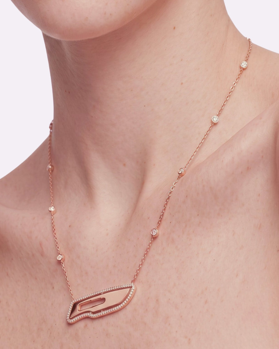 The Kiran 18K gold scalpel necklace with diamond halo by House of Rednam