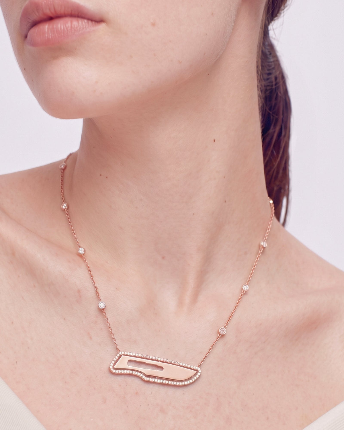 The Kiran 18K gold scalpel necklace with diamond halo by House of Rednam