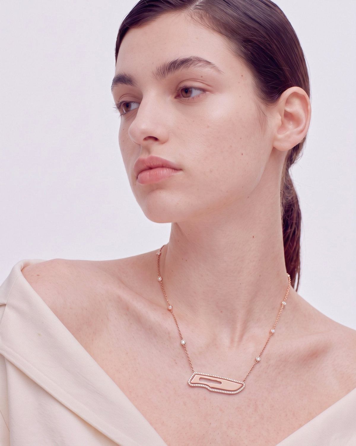 The Kiran 18K gold scalpel necklace with diamond halo by House of Rednam