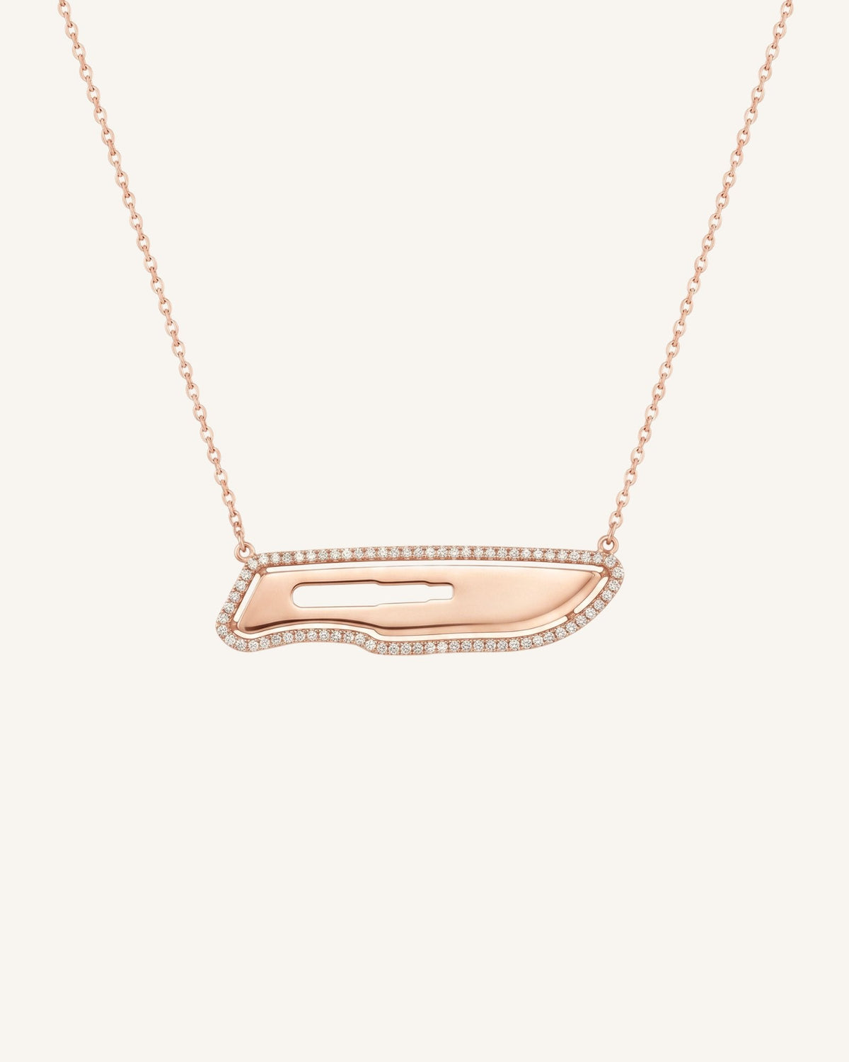 The Kiran 18K gold scalpel necklace with diamond halo by House of Rednam