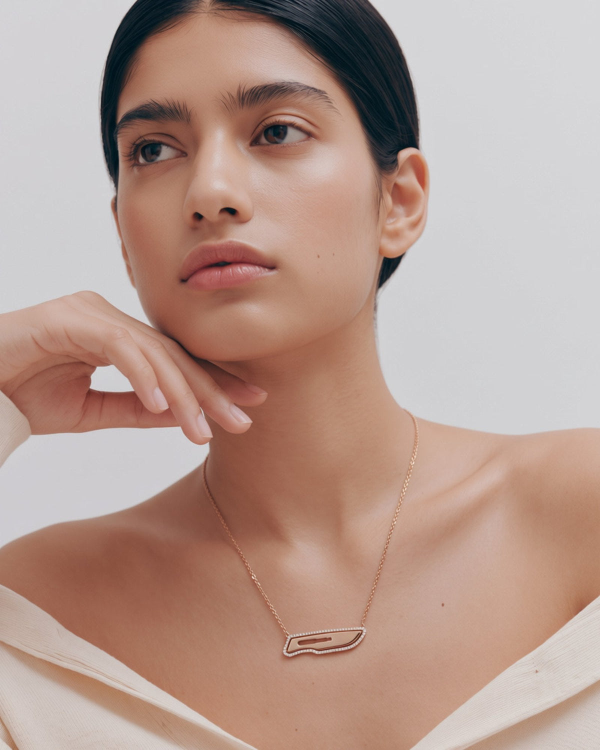 The Kiran 18K gold scalpel necklace with diamond halo by House of Rednam