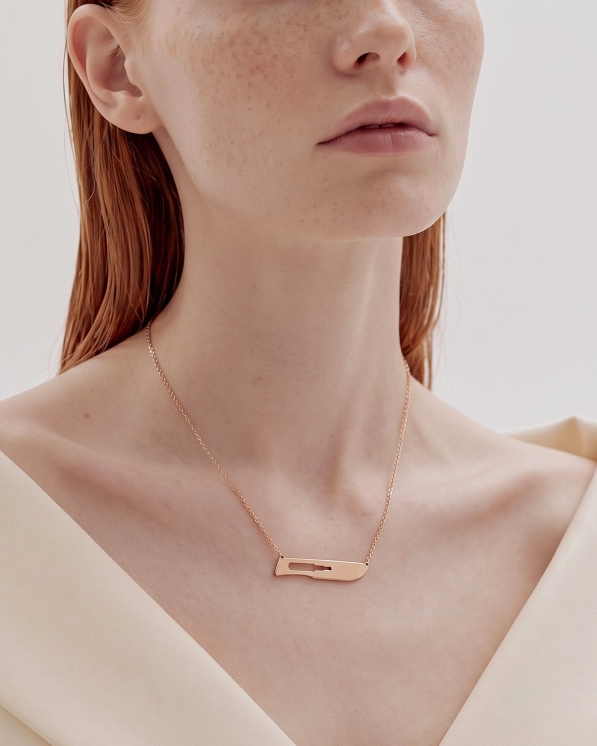 The Kiran No10 scalpel necklace in 18K rose gold by House of Rednam, view 4