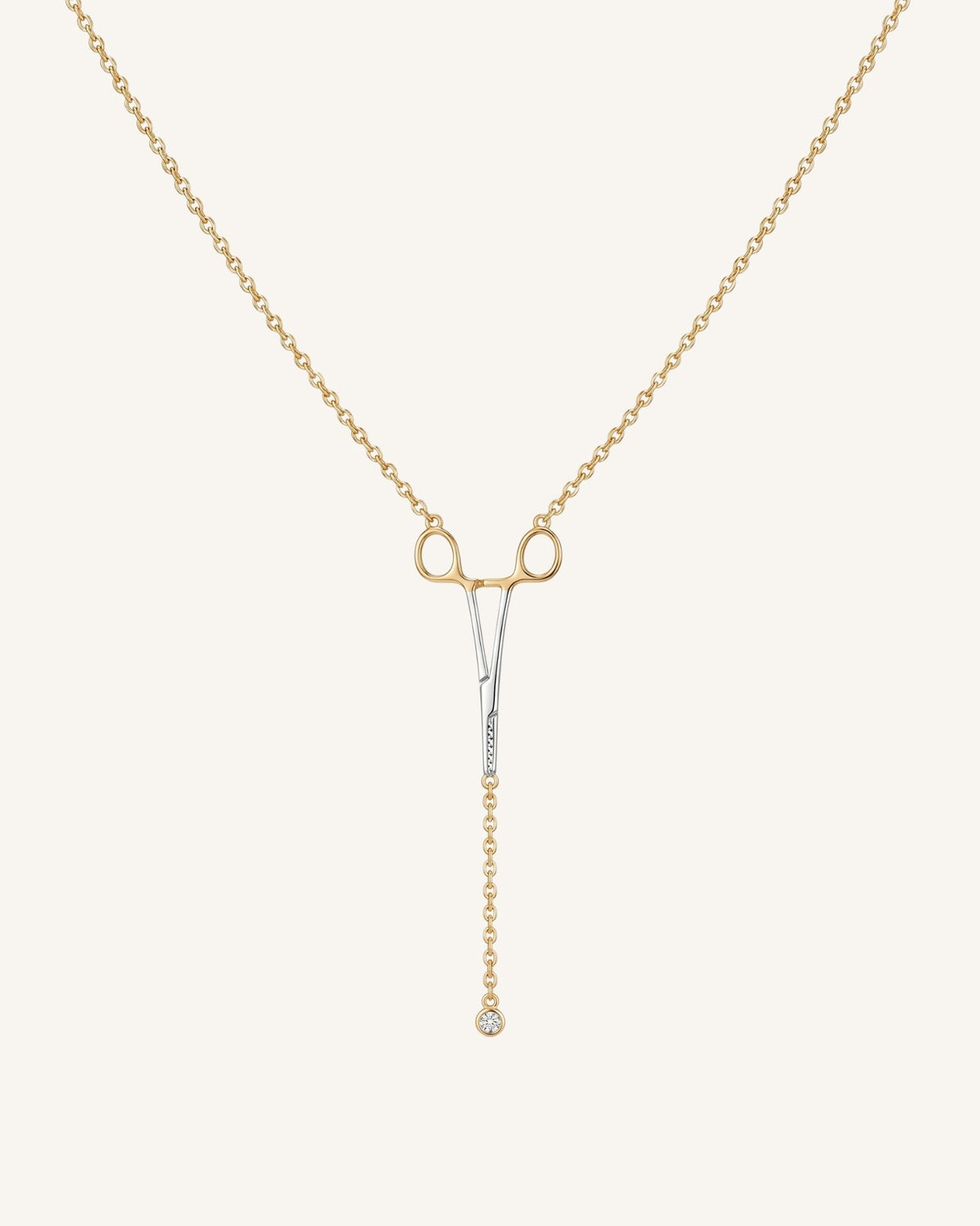 The Erin two-tone hemostat necklace in 18K yellow and white gold with a natural diamond at the hinge by House of Rednam