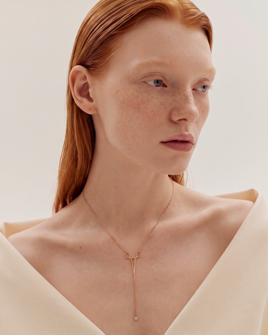 The Erin 18K rose gold hemostat necklace with a diamond at the hinge by House of Rednam