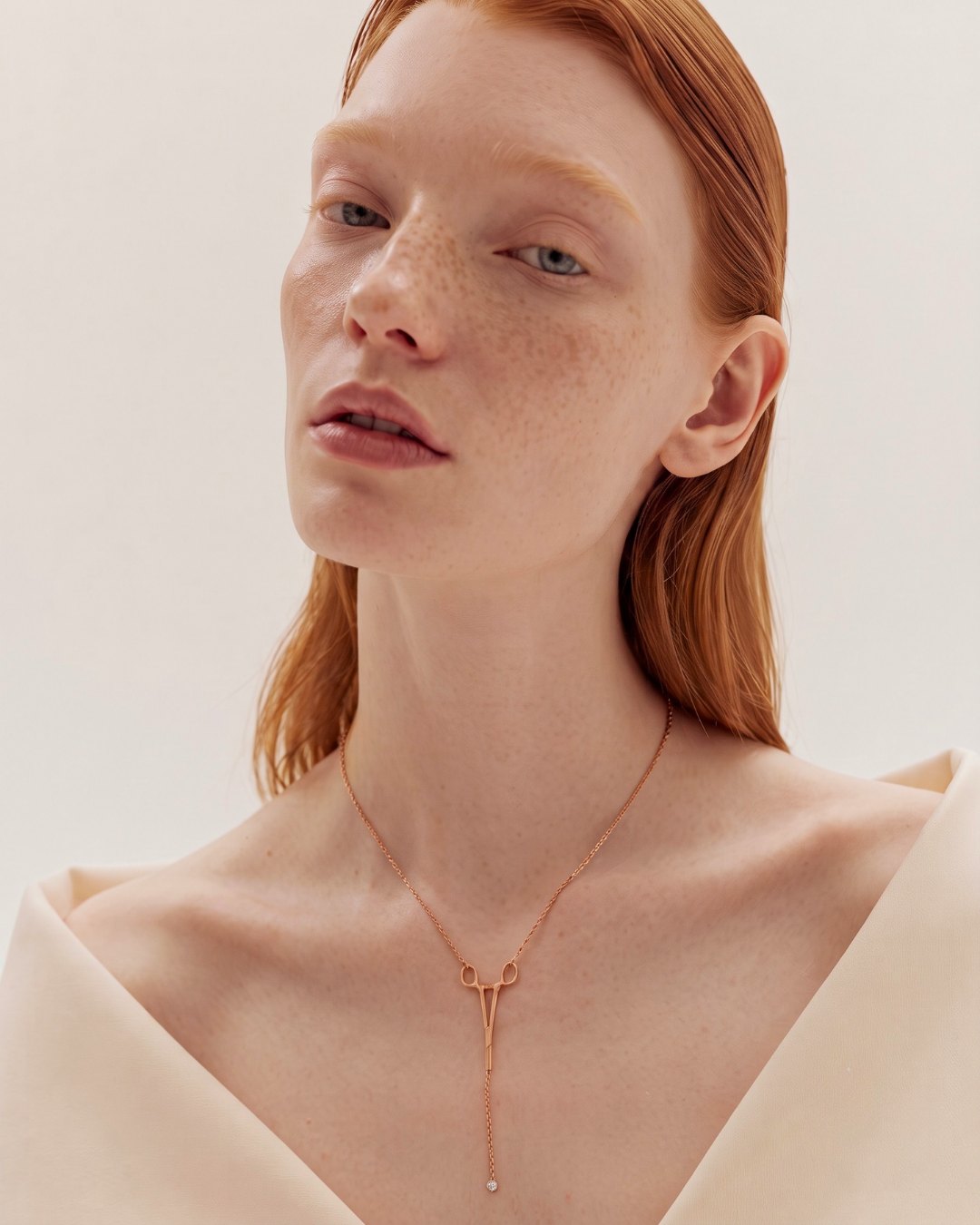 The Erin 18K rose gold hemostat necklace with a diamond at the hinge by House of Rednam