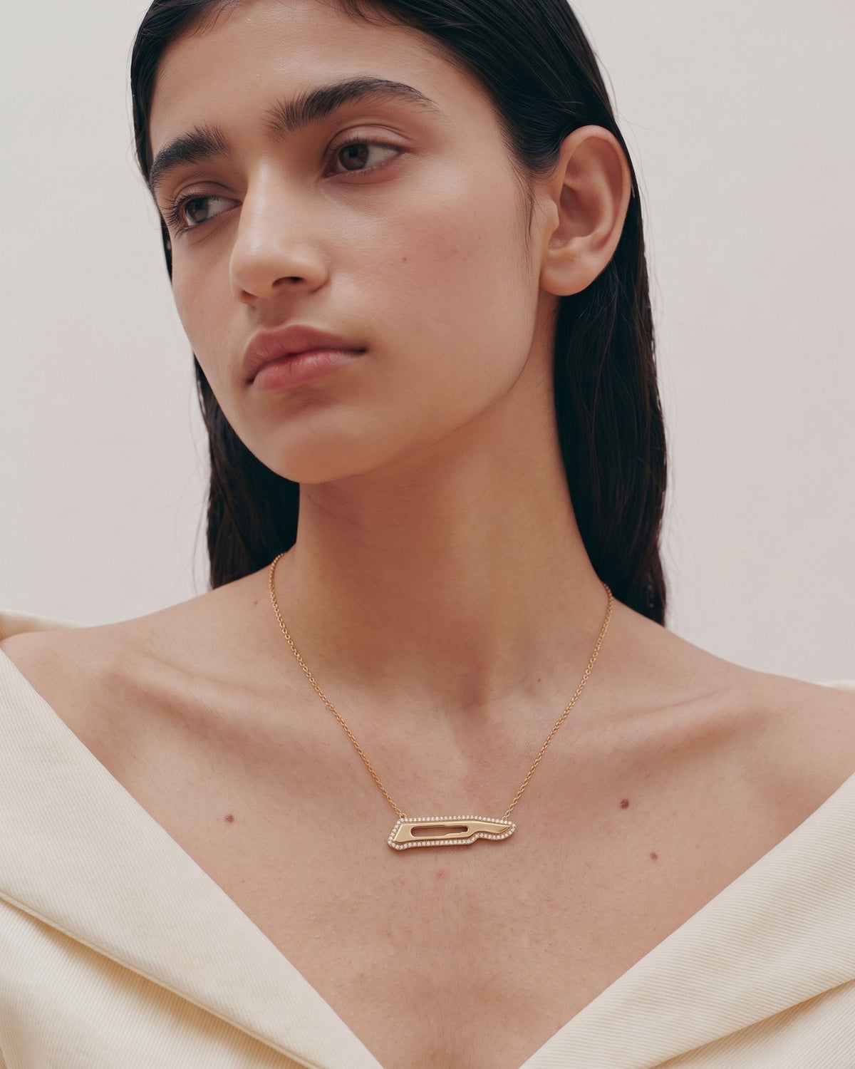 The Kiran 18K gold scalpel necklace with diamond halo by House of Rednam