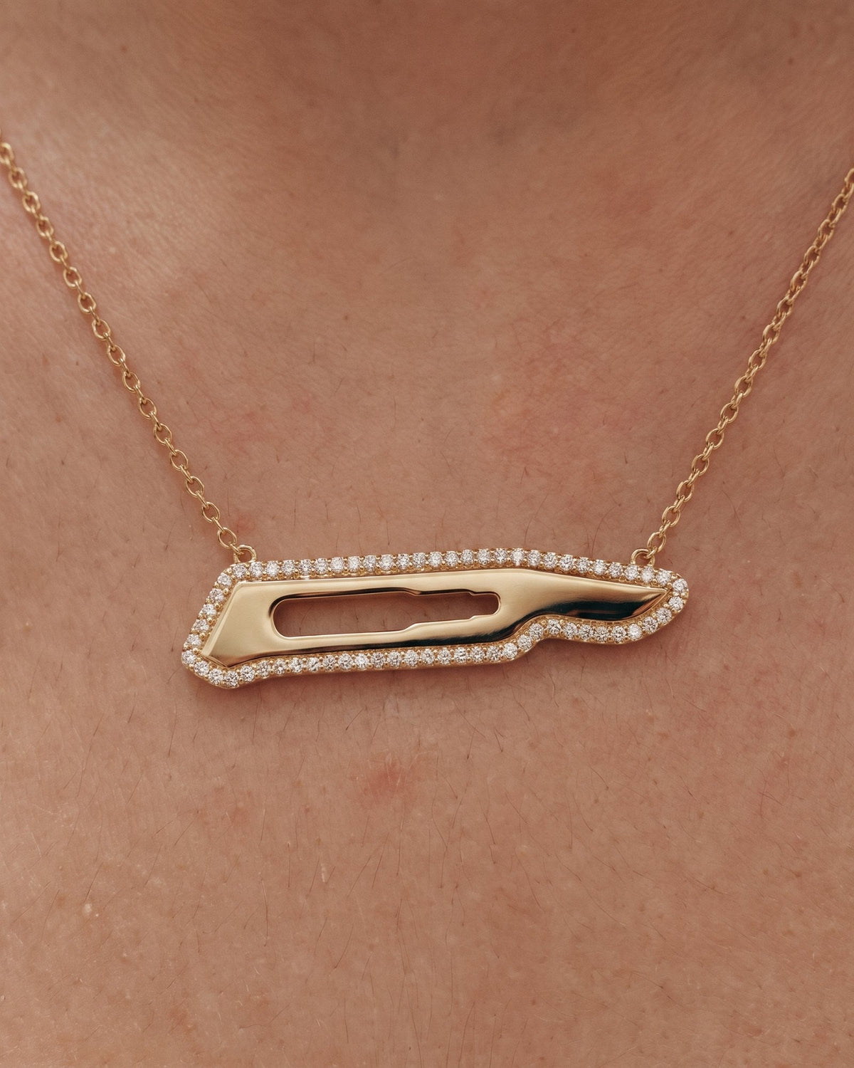 The Kiran 18K gold scalpel necklace with diamond halo by House of Rednam