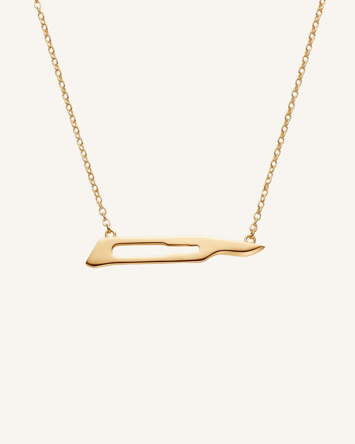 The Kiran No15C scalpel necklace in 18K yellow gold by House of Rednam