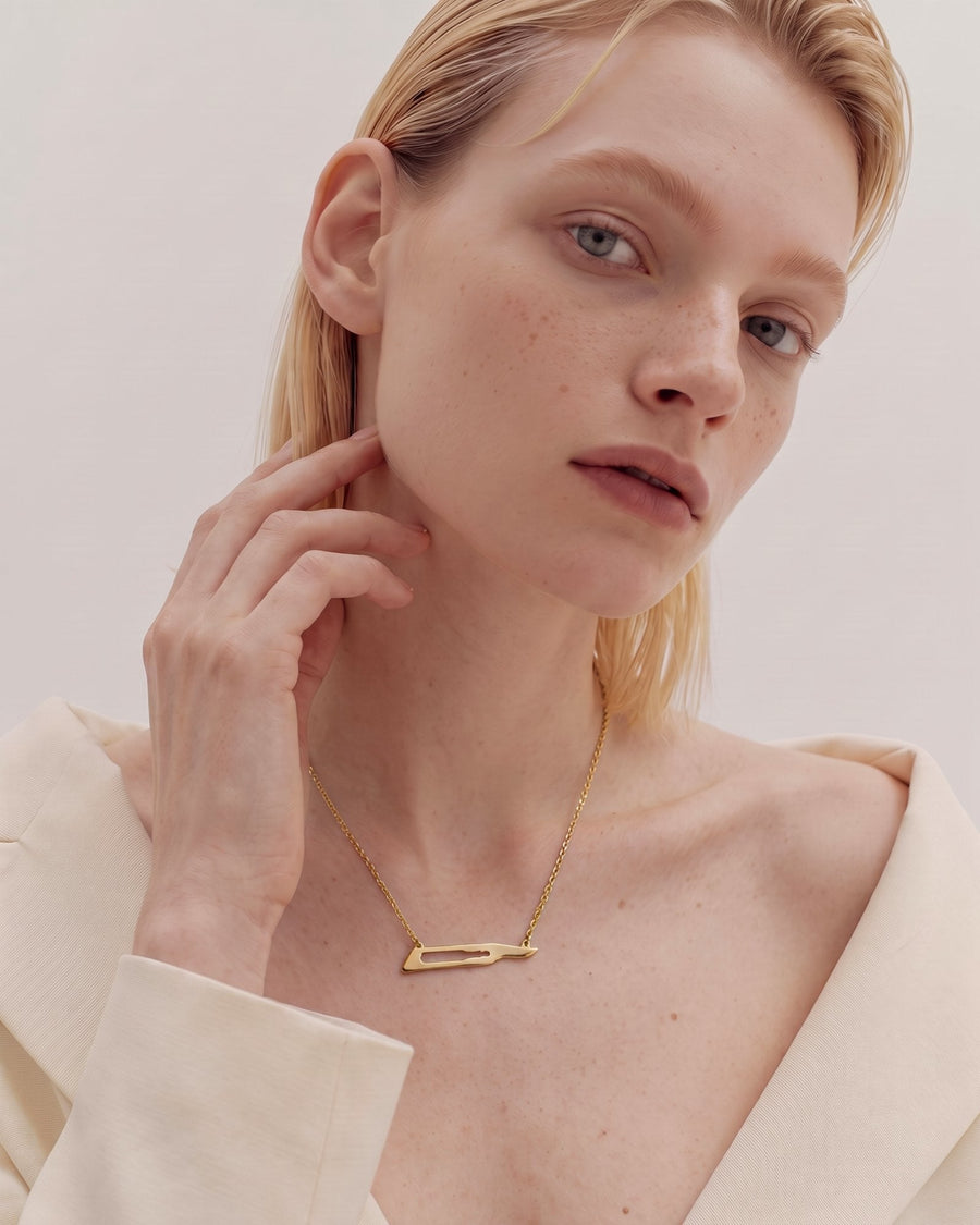 The Kiran No15C scalpel necklace in 18K yellow gold by House of Rednam