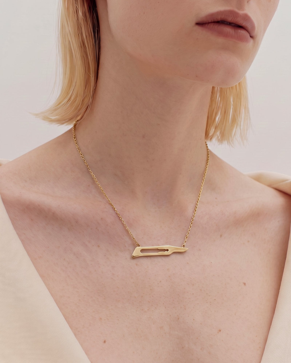 The Kiran No15C scalpel necklace in 18K yellow gold by House of Rednam, view 3