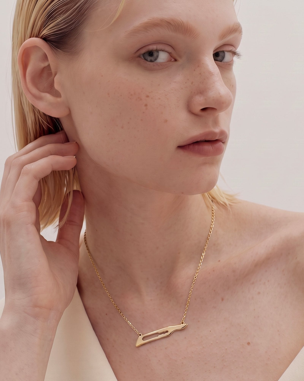 The Kiran No15C scalpel necklace in 18K yellow gold by House of Rednam, view 4