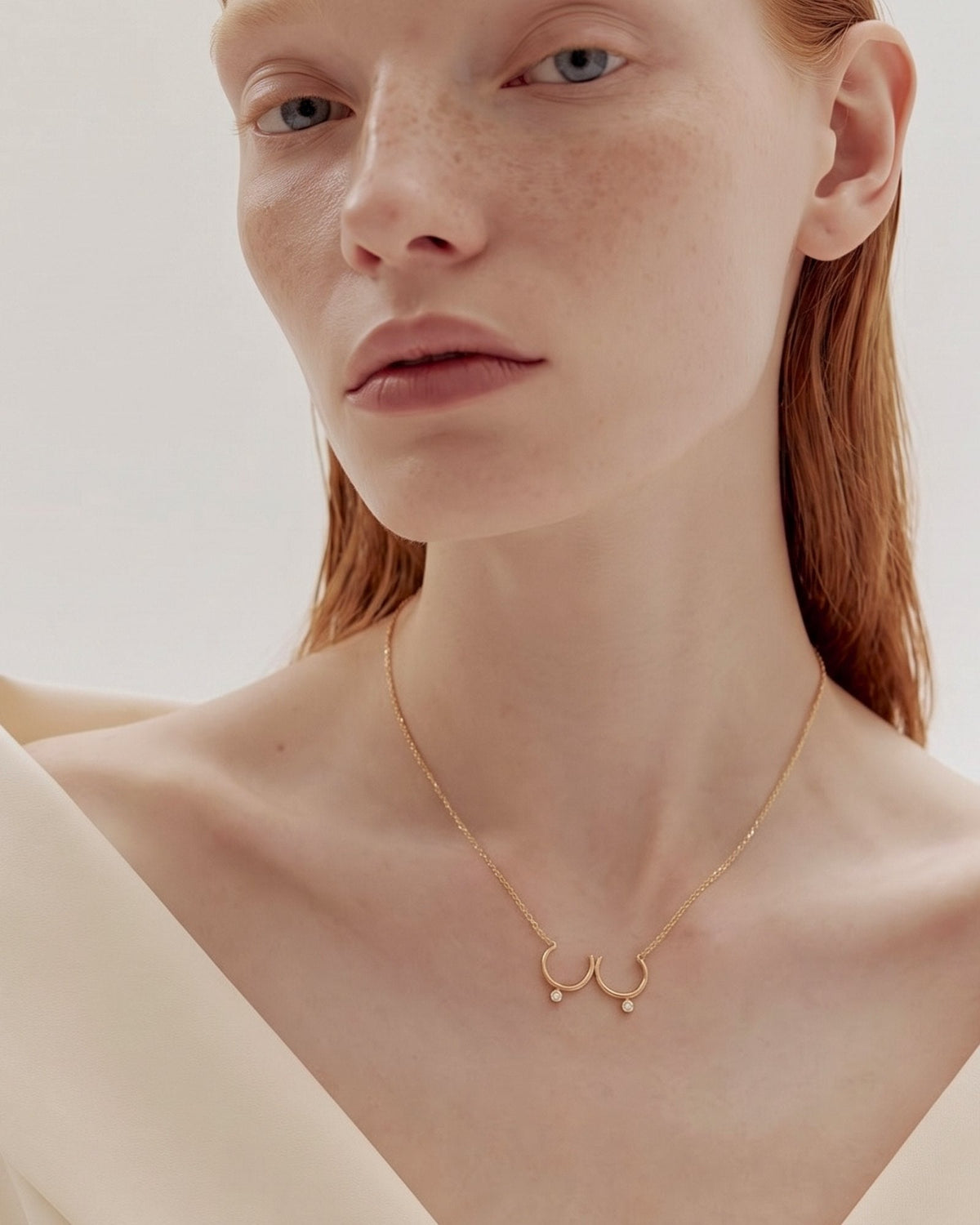 The Priya 18K gold sculpted breast necklace with diamonds by House of Rednam