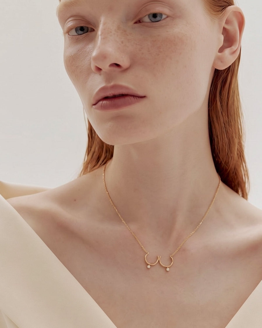 The Priya 18K gold sculpted breast necklace with diamonds by House of Rednam