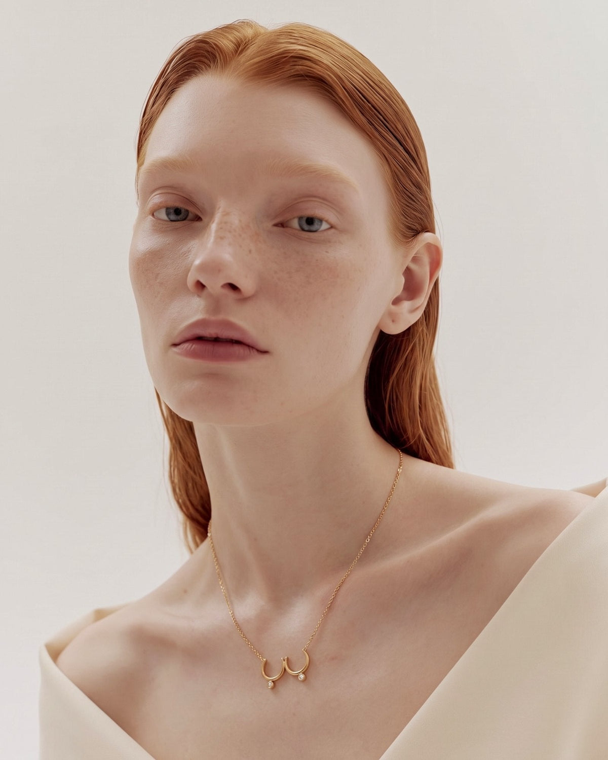 The Priya 18K gold sculpted breast necklace with diamonds by House of Rednam