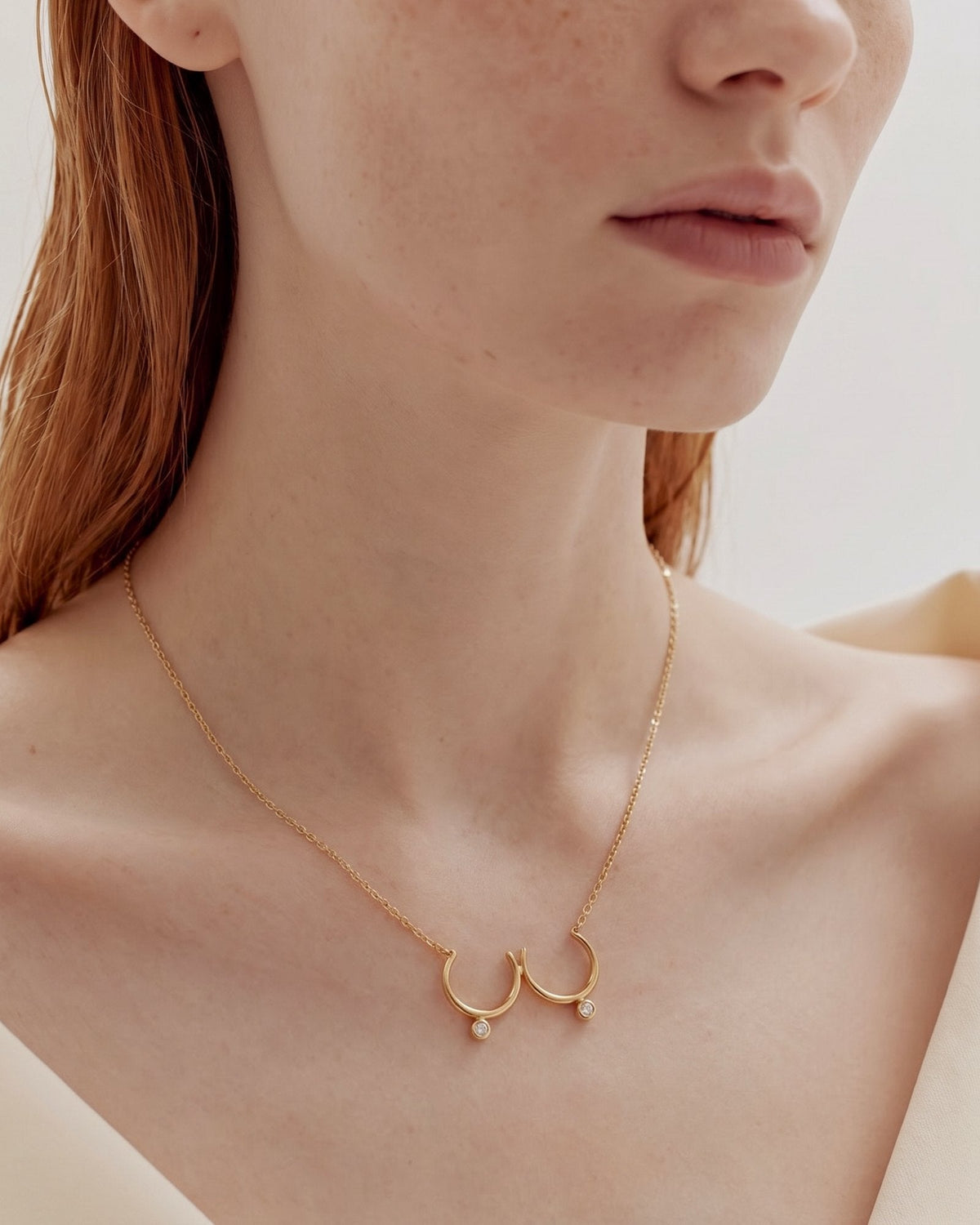 The Priya 18K gold sculpted breast necklace with diamonds by House of Rednam