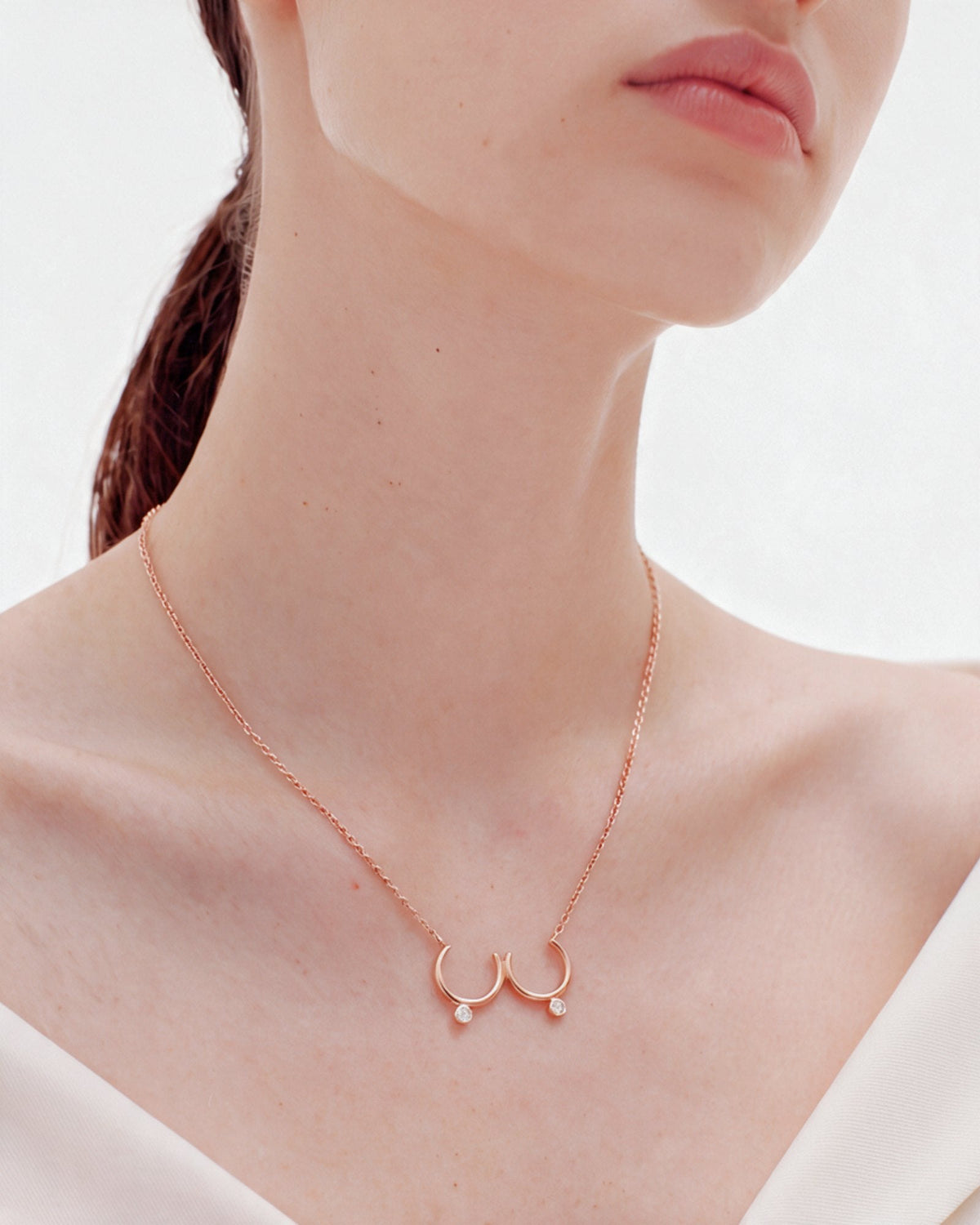 The Priya 18K gold sculpted breast necklace with diamonds by House of Rednam