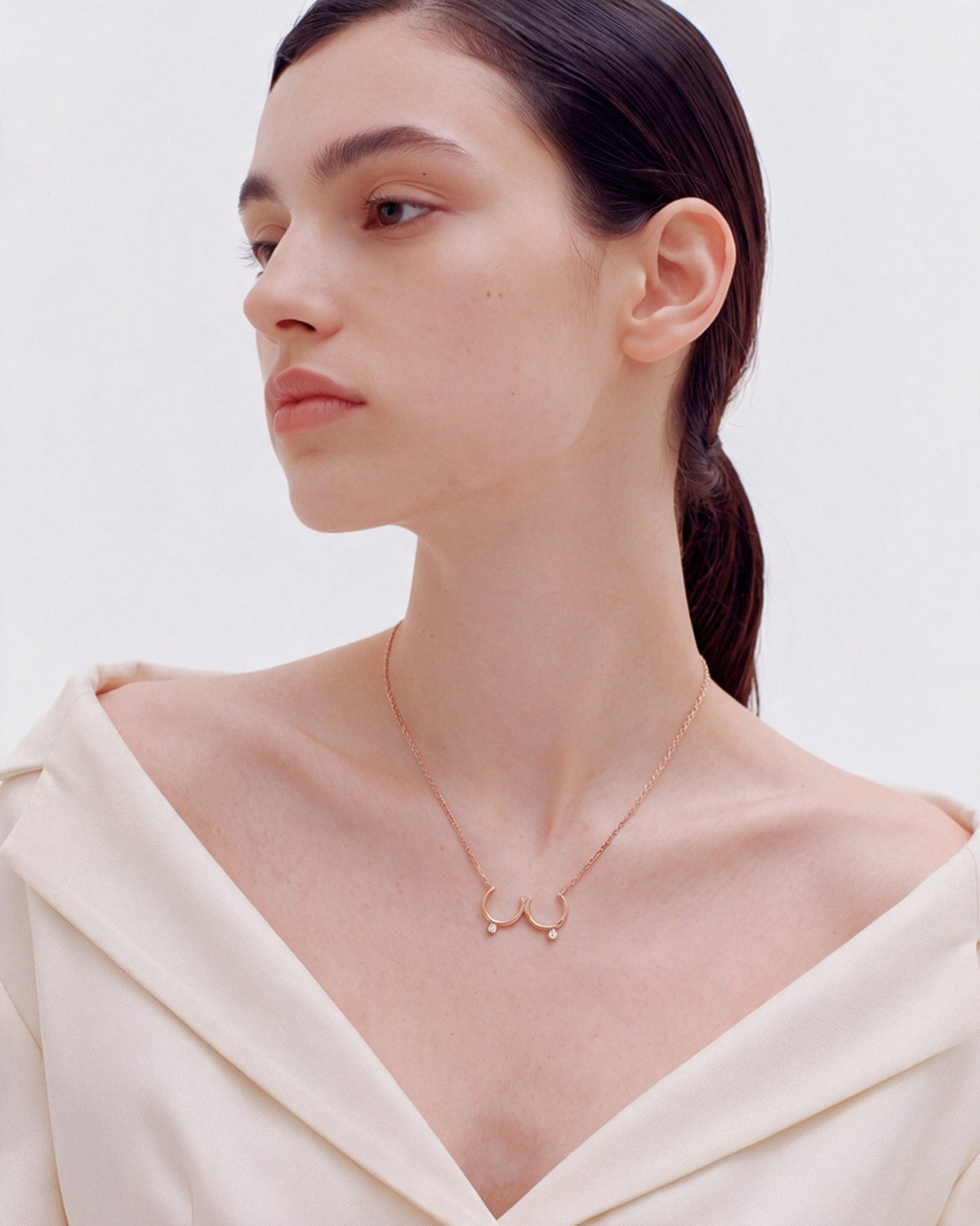 The Priya 18K gold sculpted breast necklace with diamonds by House of Rednam
