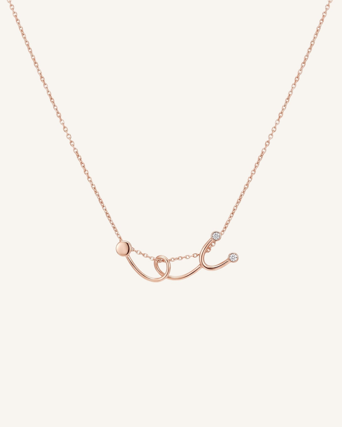 The Surya 18K gold stethoscope necklace with a diamond at each earpiece by House of Rednam