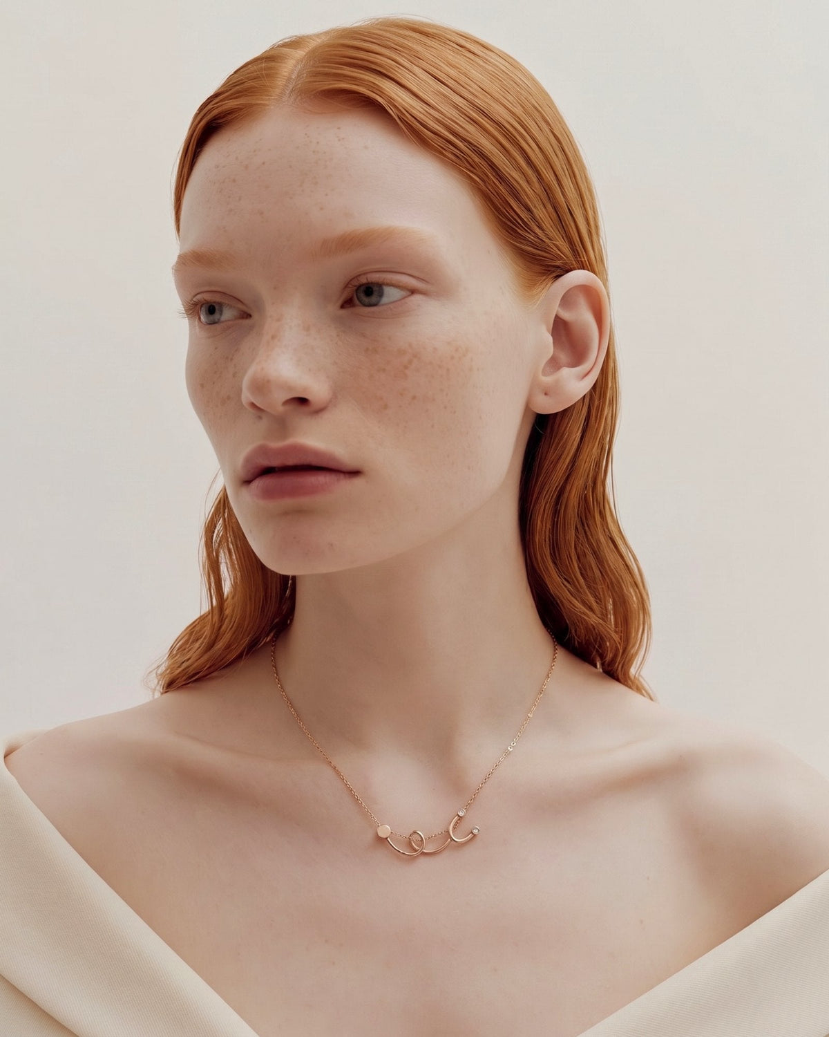 The Surya 18K gold stethoscope necklace with a diamond at each earpiece by House of Rednam