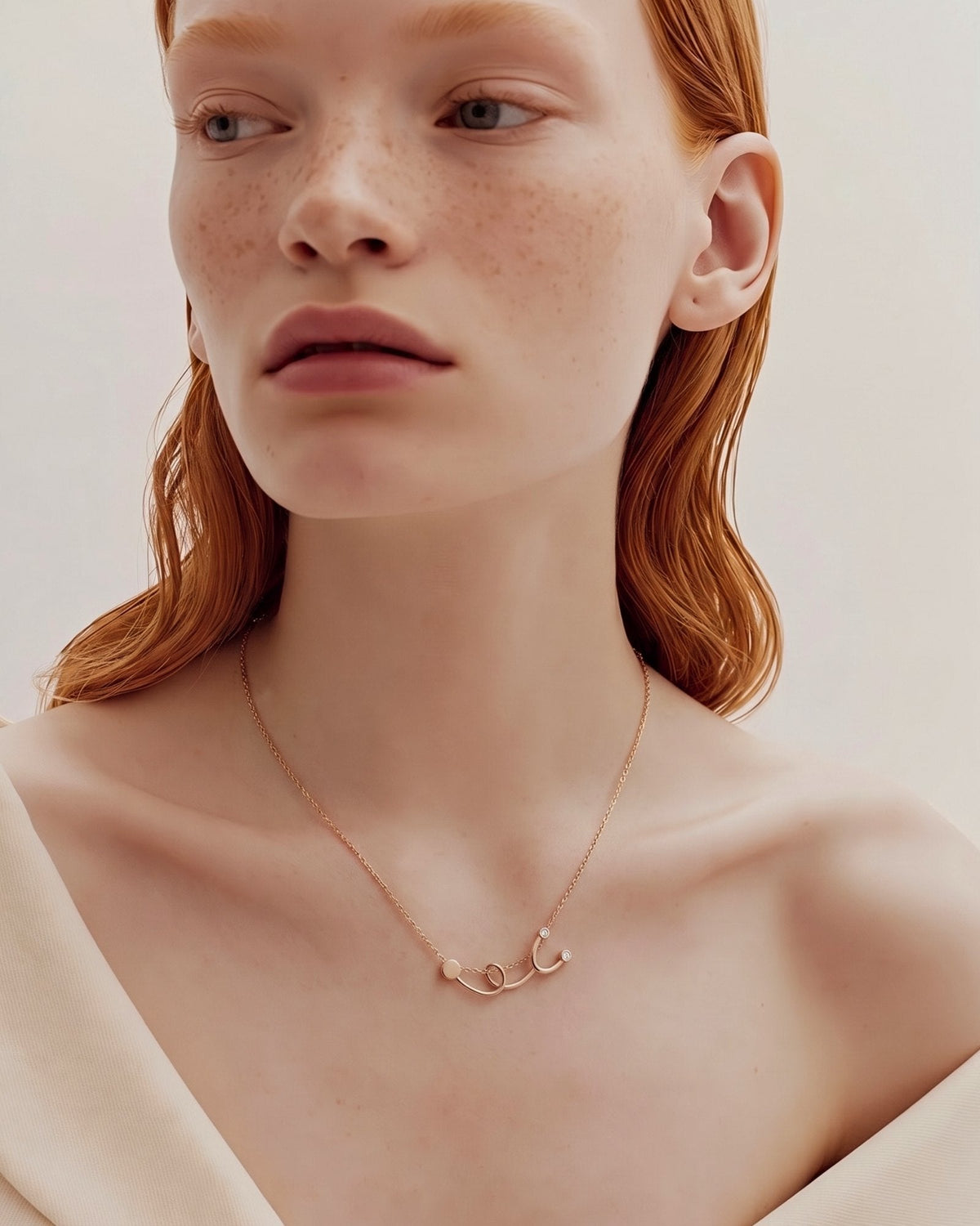 The Surya 18K gold stethoscope necklace with a diamond at each earpiece by House of Rednam