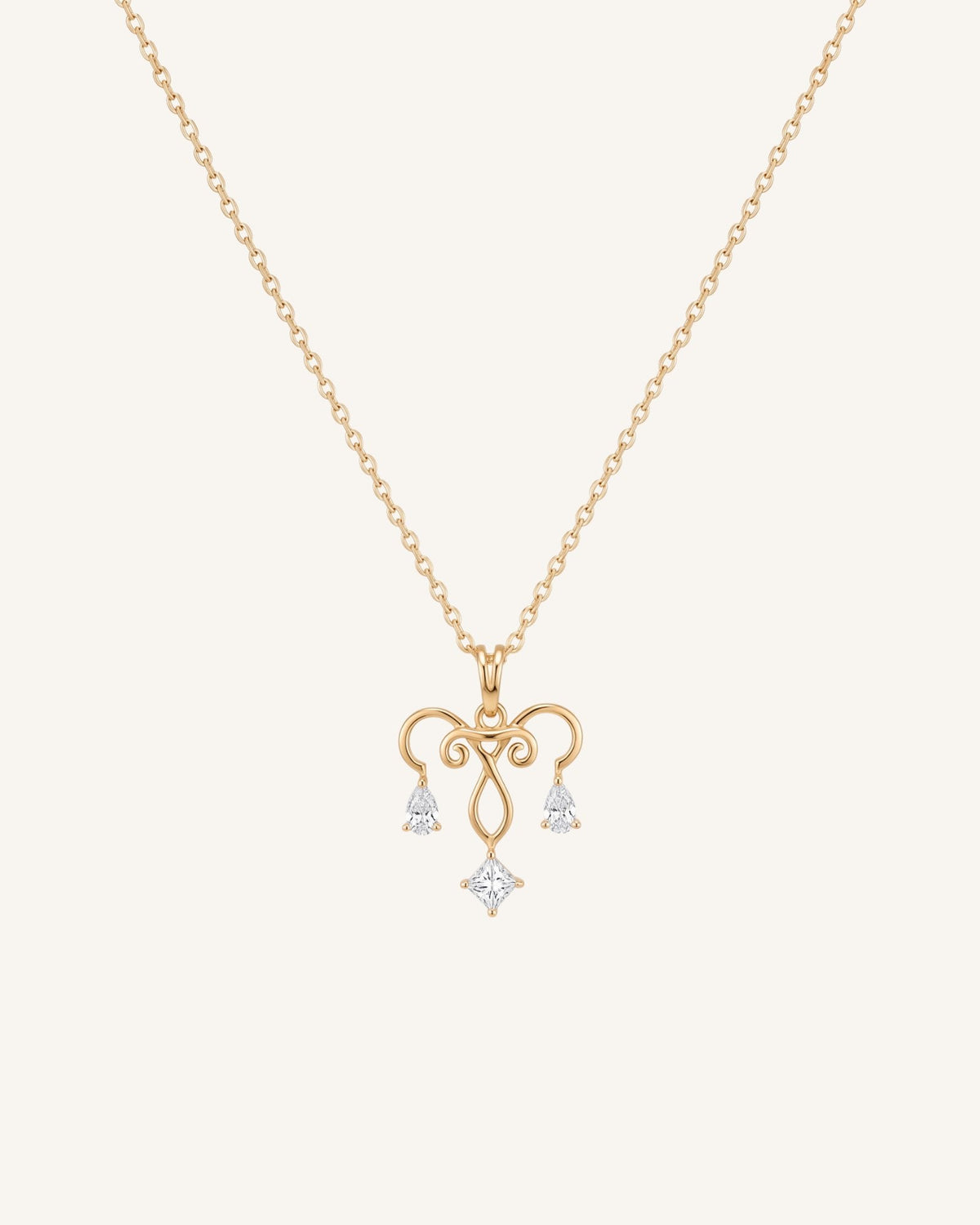 The Chandra 18K gold uterus necklace with diamond ovarian detail by House of Rednam
