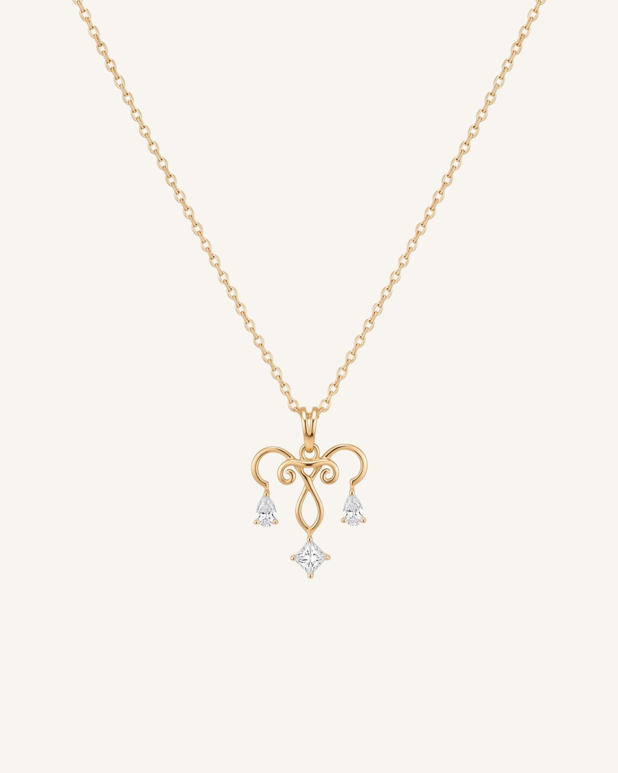 The Chandra 18K gold uterus necklace with diamond ovarian detail by House of Rednam