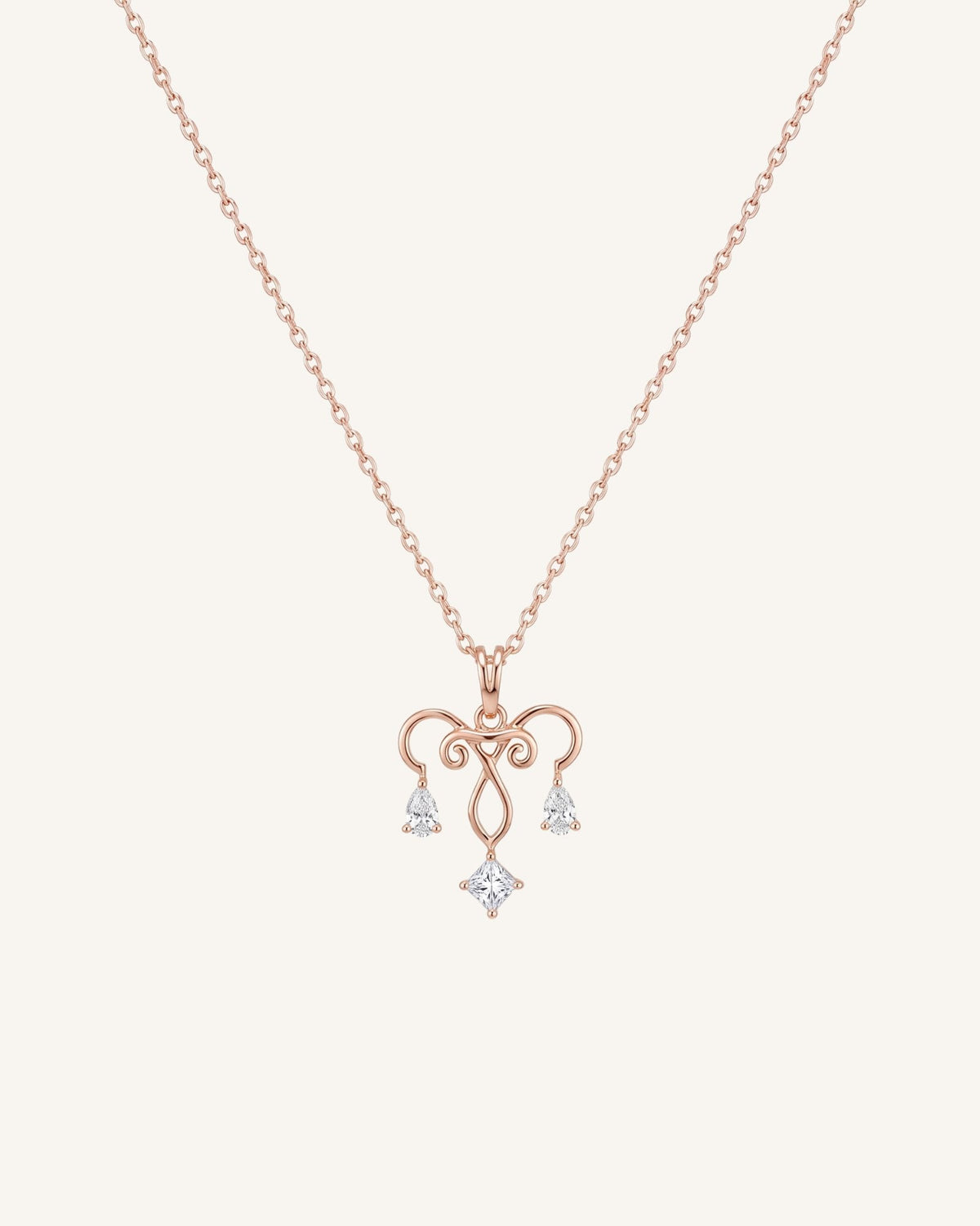 The Chandra 18K gold uterus necklace with diamond ovarian detail by House of Rednam