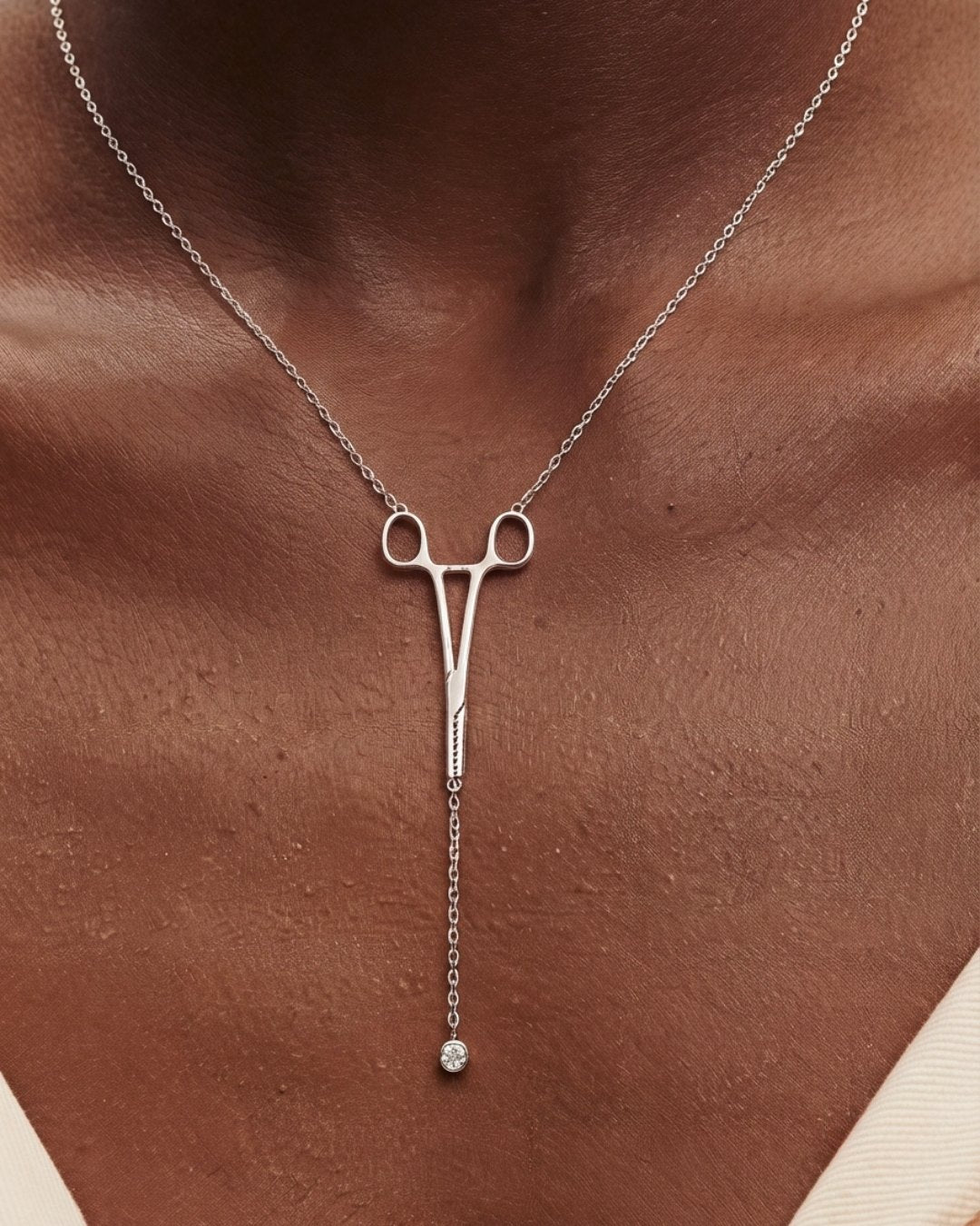 The Erin sterling silver hemostat necklace with a diamond at the hinge by House of Rednam