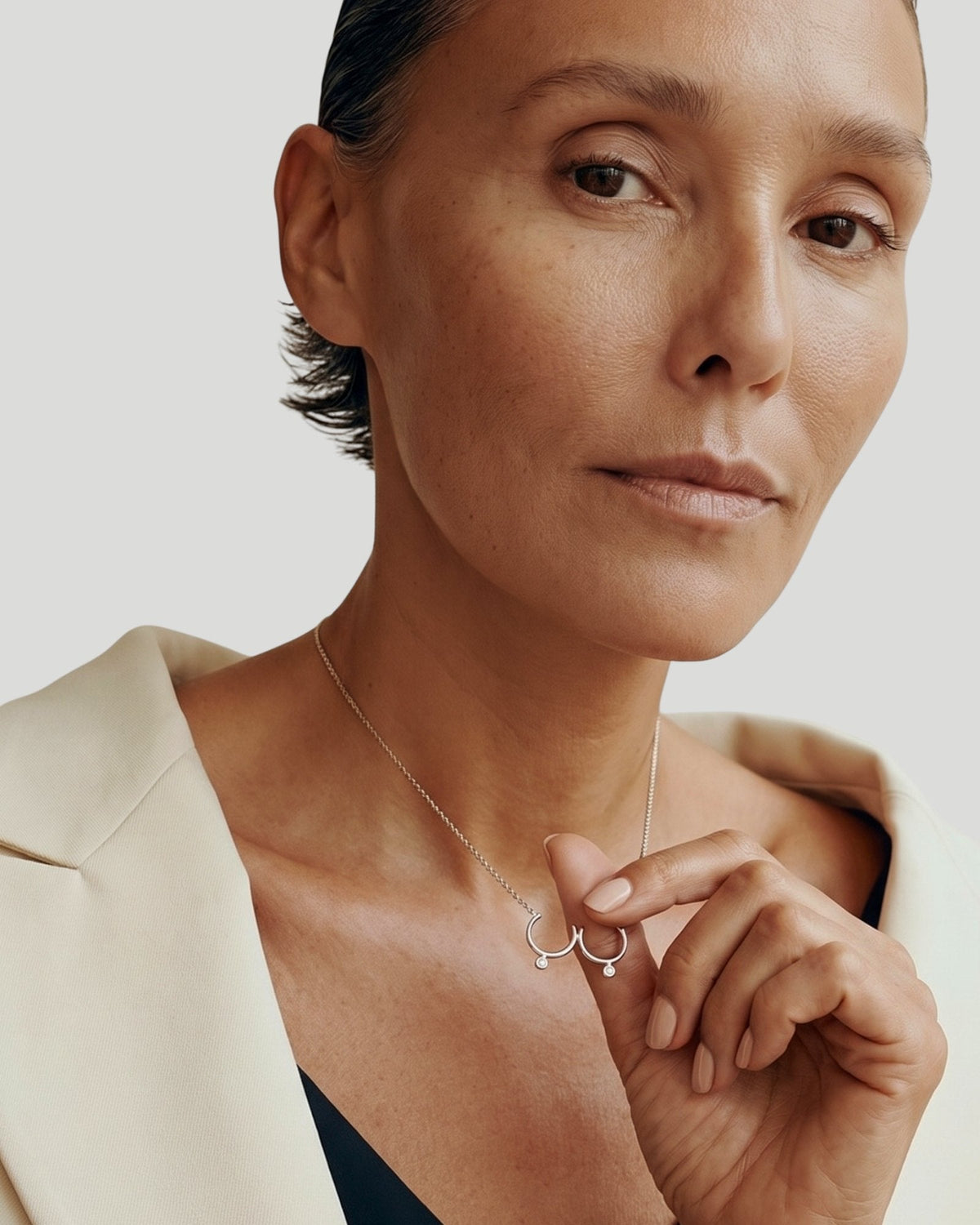 The Priya sterling silver sculpted breast necklace with diamonds by House of Rednam