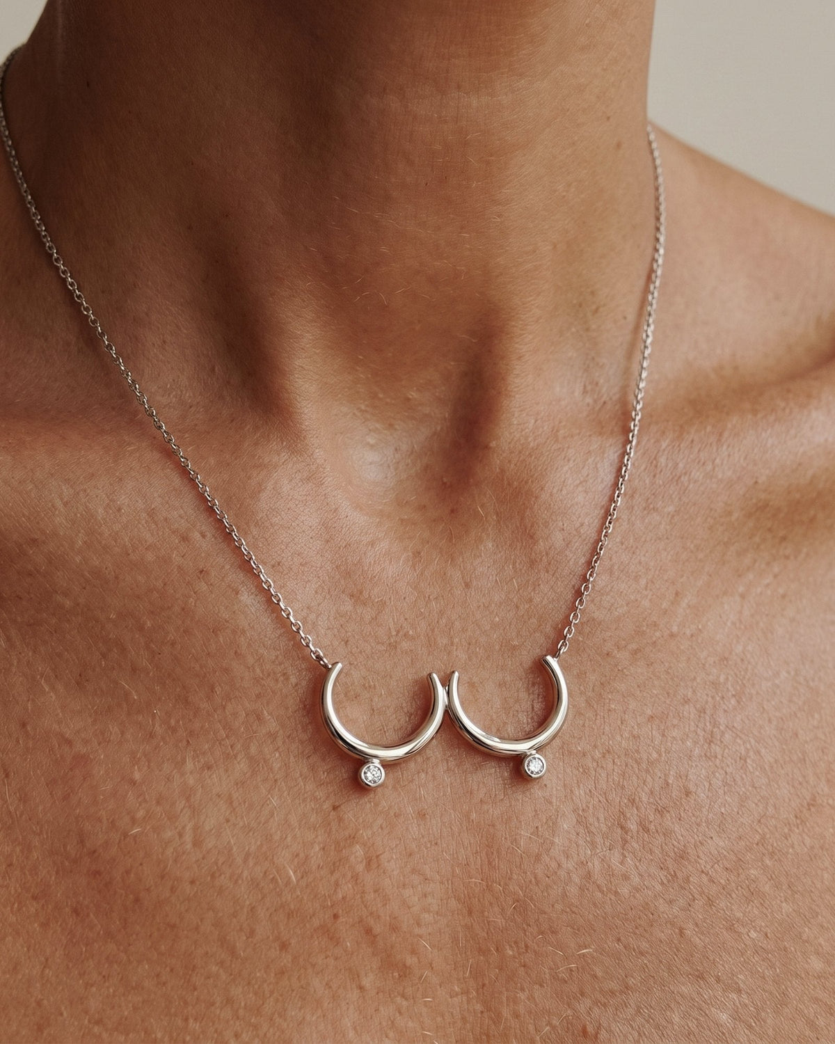 The Priya sterling silver sculpted breast necklace with diamonds by House of Rednam