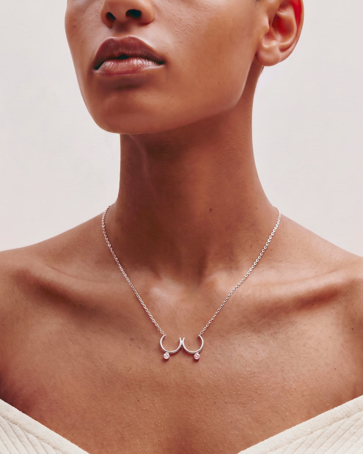 The Priya sterling silver sculpted breast necklace with Pink Sapphires by House of Rednam