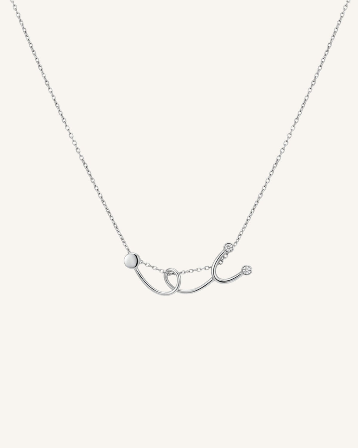 The Surya sterling silver stethoscope necklace with a diamond at each earpiece by House of Rednam