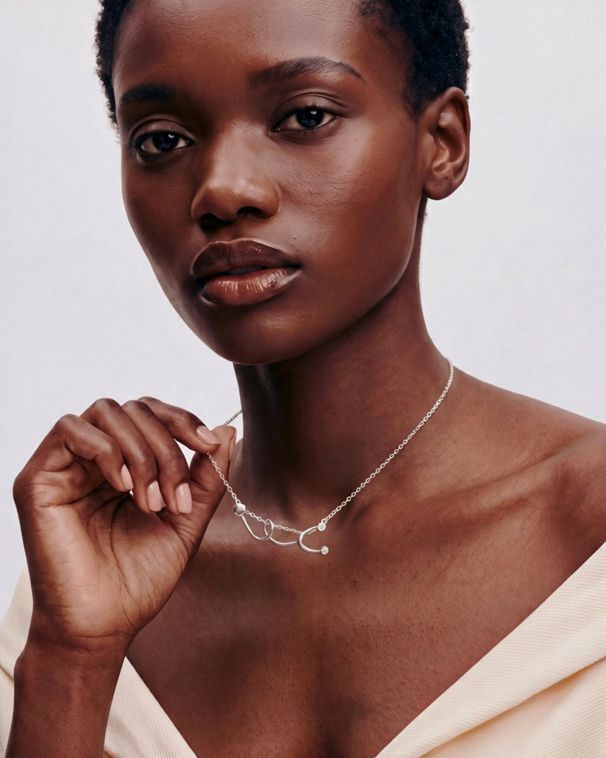 The Surya sterling silver stethoscope necklace with a diamond at each earpiece by House of Rednam