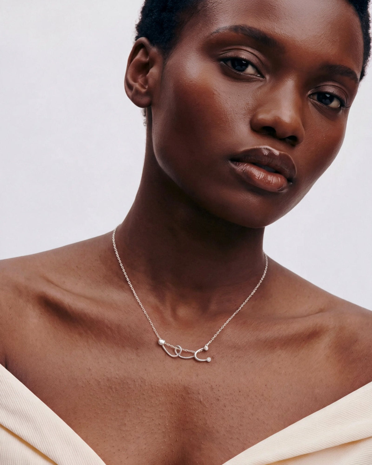 The Surya sterling silver stethoscope necklace with a diamond at each earpiece by House of Rednam