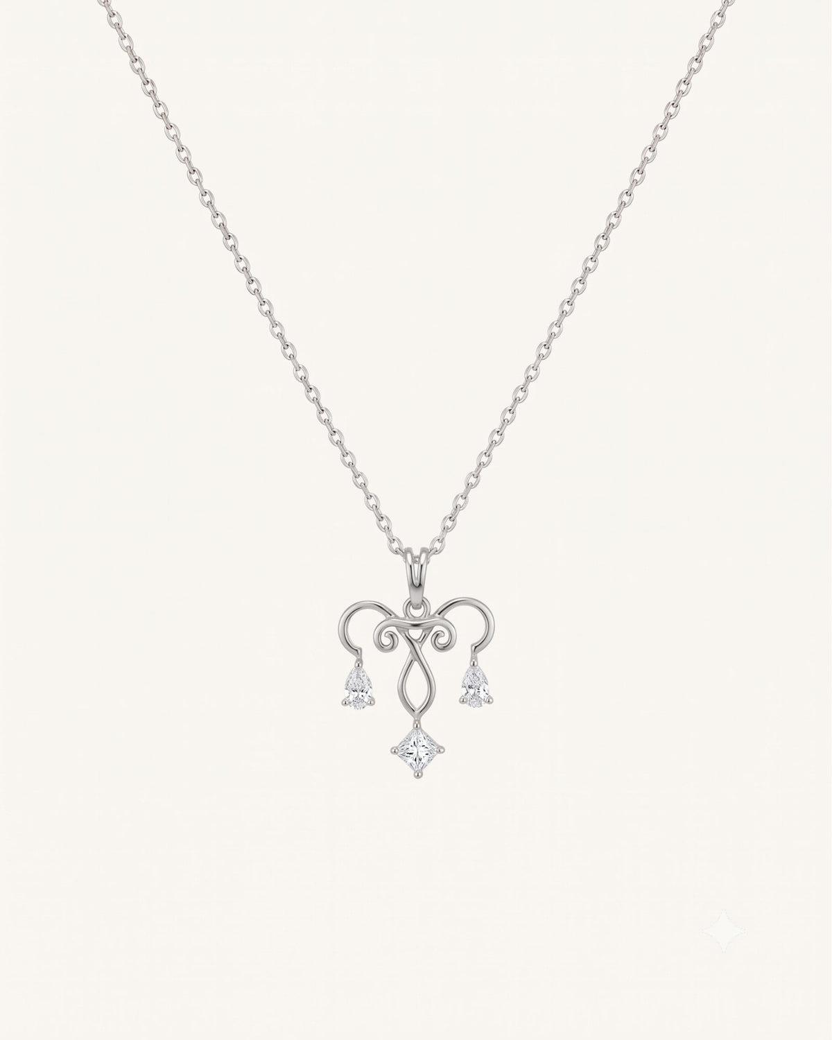 The Chandra sterling silver uterus necklace with diamond ovarian detail by House of Rednam