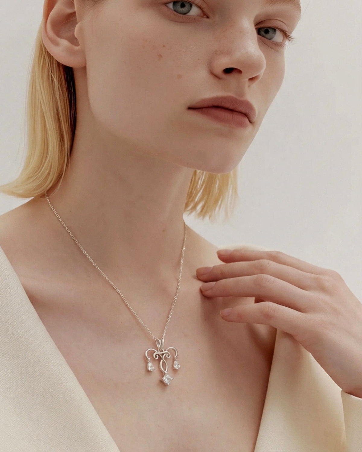 The Chandra sterling silver uterus necklace with diamond ovarian detail by House of Rednam