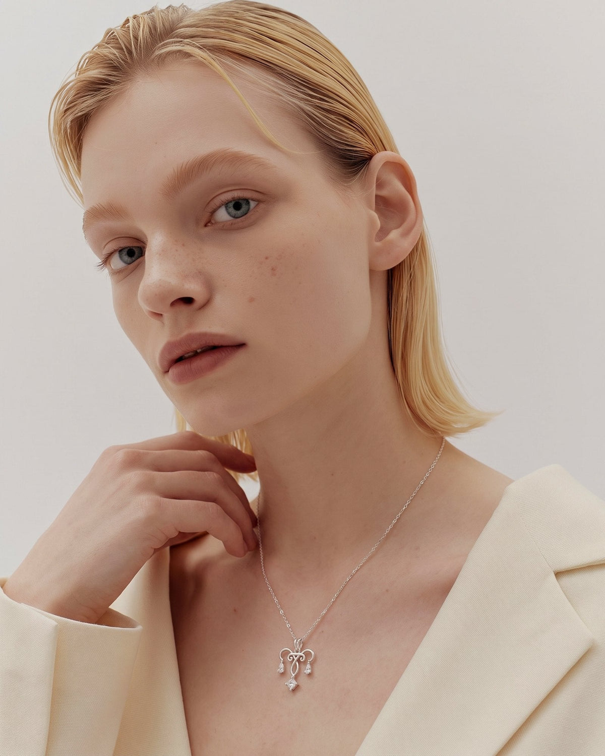 The Chandra sterling silver uterus necklace with diamond ovarian detail by House of Rednam