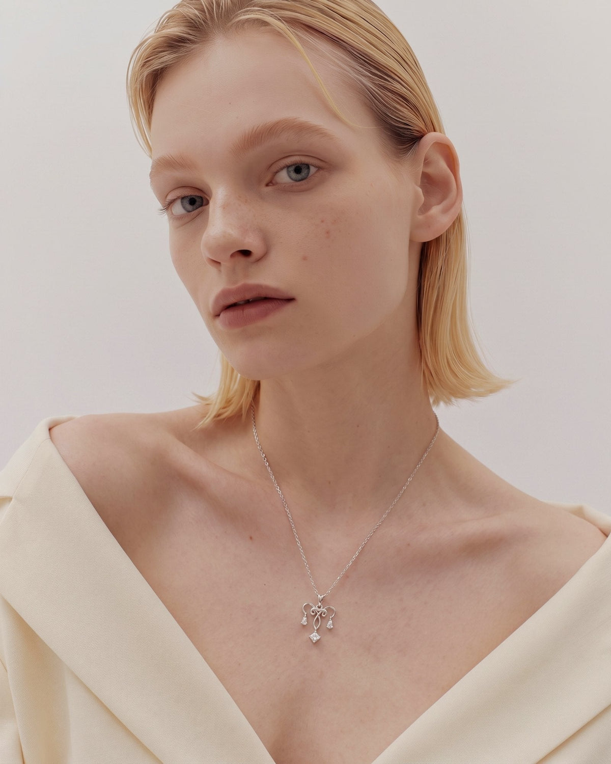 The Chandra sterling silver uterus necklace with diamond ovarian detail by House of Rednam