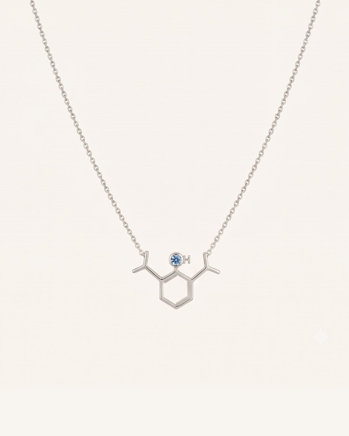 The Johanna sterling silver propofol molecule necklace with blue topaz by House of Rednam