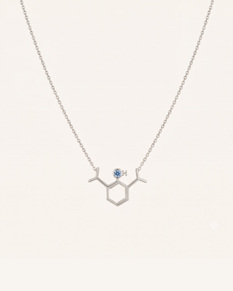 The Johanna sterling silver propofol molecule necklace with blue topaz by House of Rednam