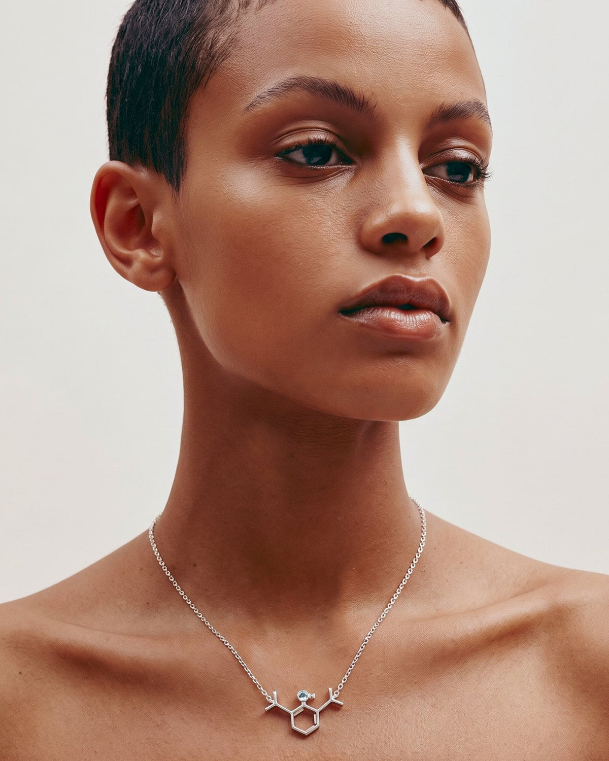 The Johanna sterling silver propofol molecule necklace with blue topaz by House of Rednam
